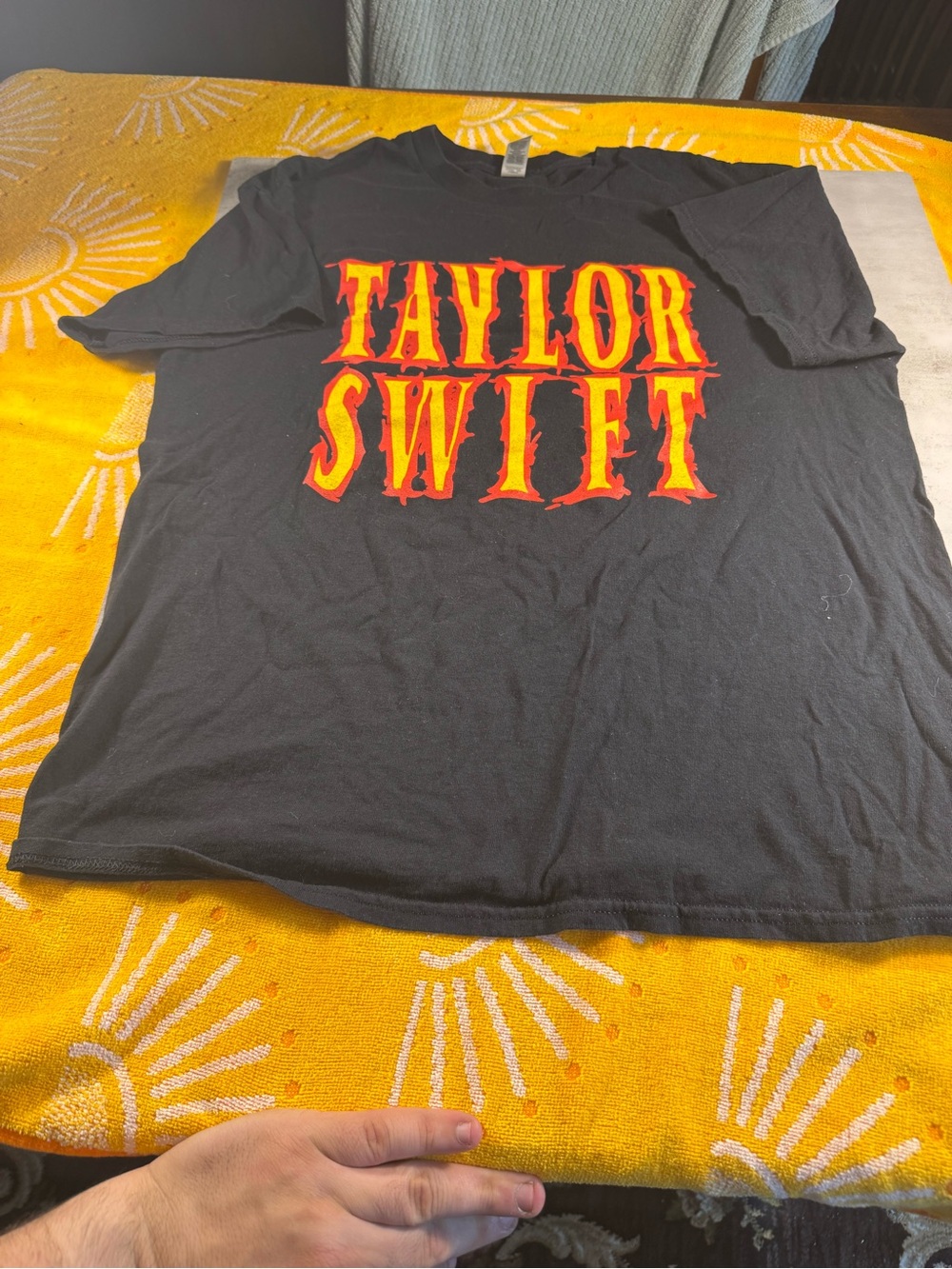 Gildan Black Taylor Swift Graphic Tee with Red and Yellow Lettering
